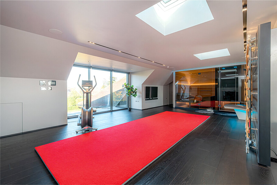 Homes Fit for Footballers: Surrey's Finest Properties with Pools, Gyms and Private Leisure Facilities